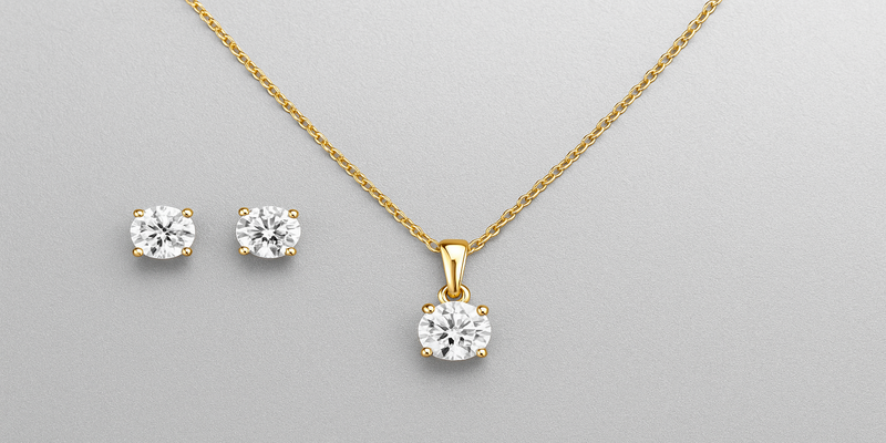 significato parure di gioielli orecchini e collana oro e argento